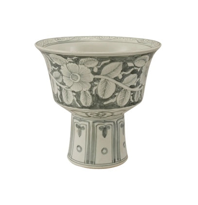 Green stoneware footed planter with floral design